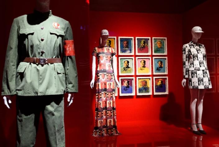 Art work by Andy Warhol and a dress by Vivienne Tam are displayed as part of "China Through the Looking Glass" on May 4, 2015 at the Metropolitan Museum of Art in New York (AFP Photo/Don Emmert)