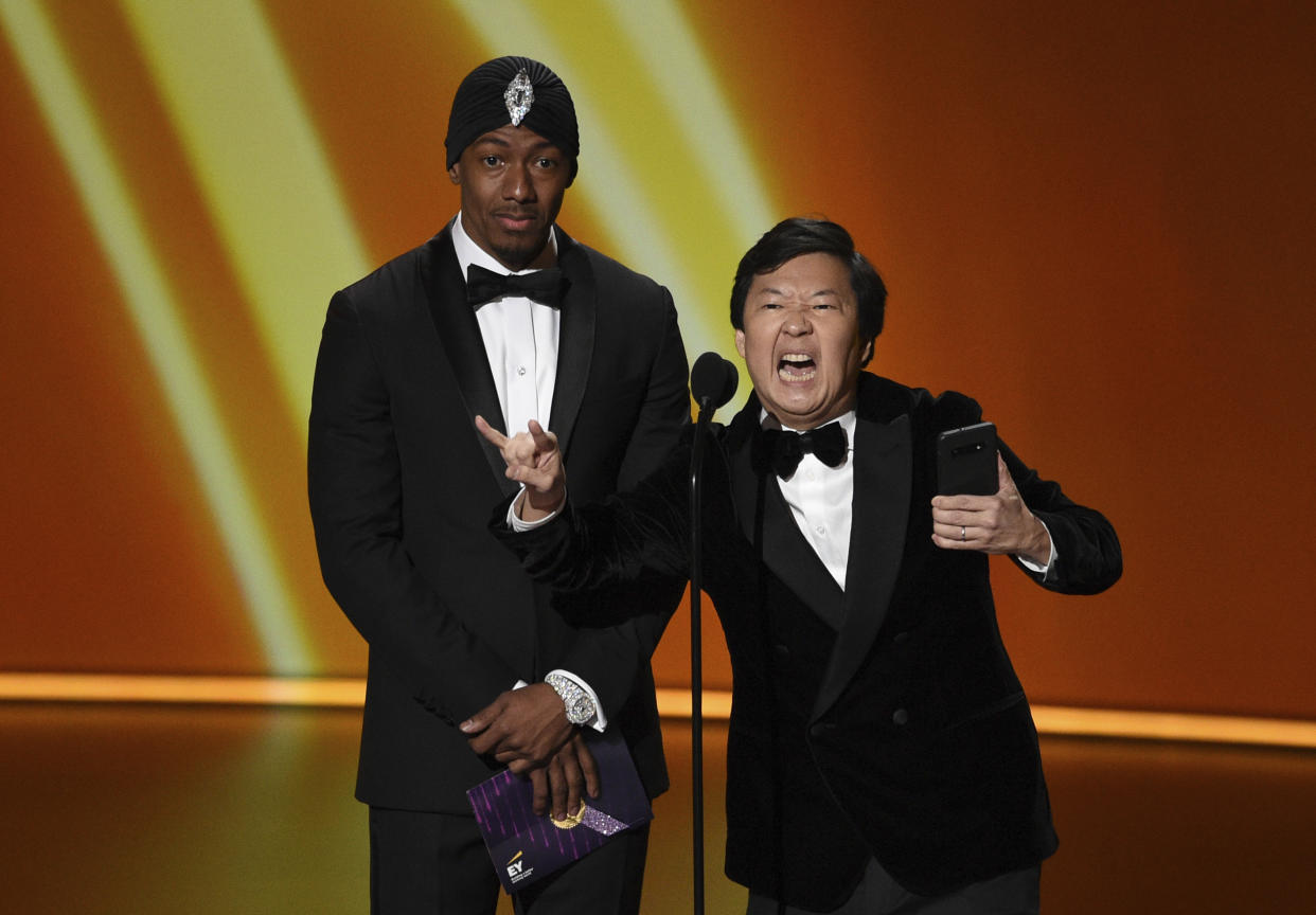 Nick Cannon, left, and Ken Jeong present the award for outstanding writing for a comedy series at the 71st Primetime Emmy Awards on Sunday, Sept. 22, 2019, at the Microsoft Theater in Los Angeles. (Photo by Chris Pizzello/Invision/AP)