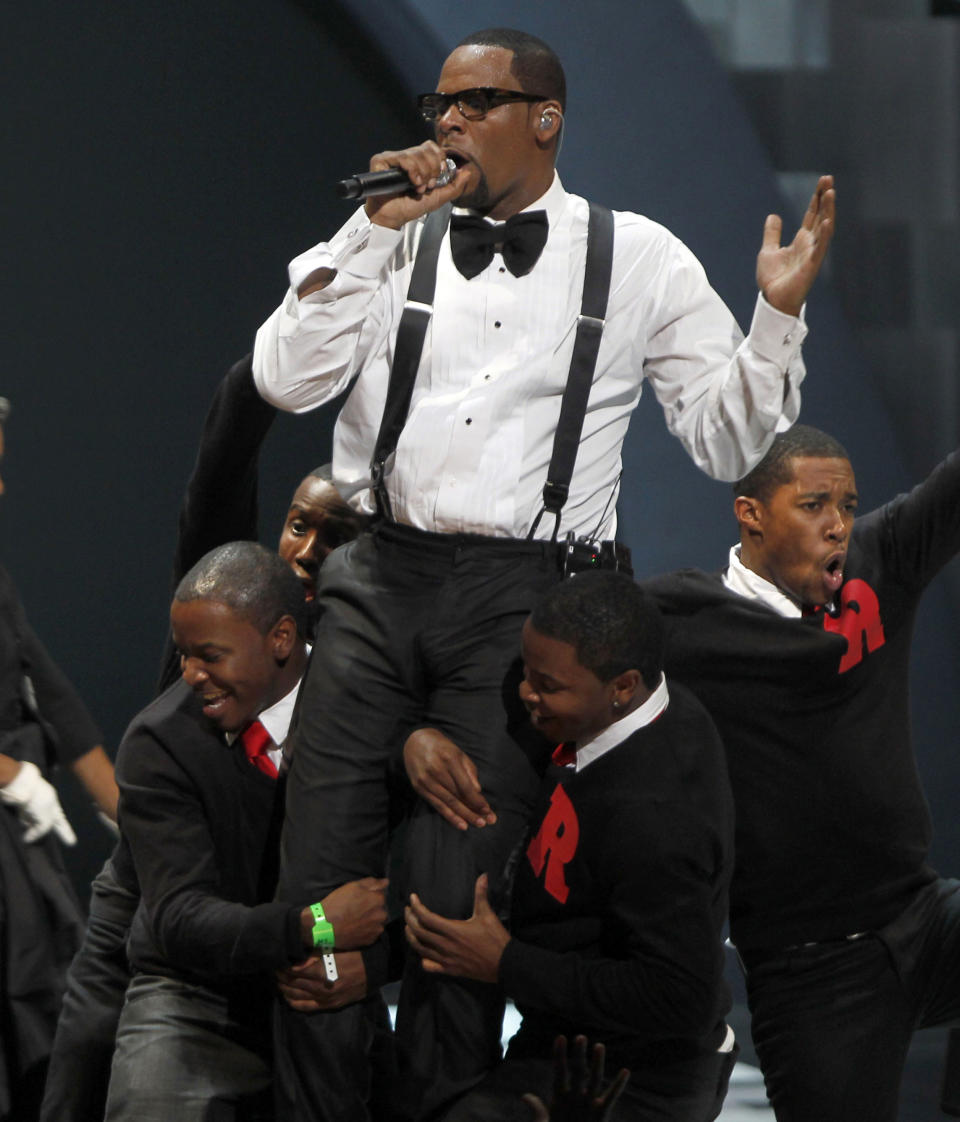 FILE - In this Nov. 10, 2010 file photo, singer R. Kelly performs "When A Woman Loves," during the Soul Train awards in Atlanta. Kelly, one of the top-selling recording artists of all time, has been hounded for years by allegations of sexual misconduct involving women and underage girls _ accusations he and his attorneys have long denied. But an Illinois prosecutor’s plea for potential victims and witnesses to come forward has sparked hope among some advocates that the R&B star might face new charges. (AP Photo/David Goldman, file)