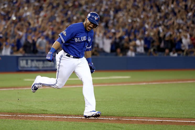 TORONTO, ON - OCTOBER 18: Edwin Encarnacion #10 of the Toronto Blue Jays celebrates after hitting an RBI double scoring Ryan Goins #17 and Jose Bautista #19 in the seventh inning against Bryan Shaw #27 of the Cleveland Indians during game four of the American League Championship Series at Rogers Centre on October 18, 2016 in Toronto, Canada. (Photo by Elsa/Getty Images)