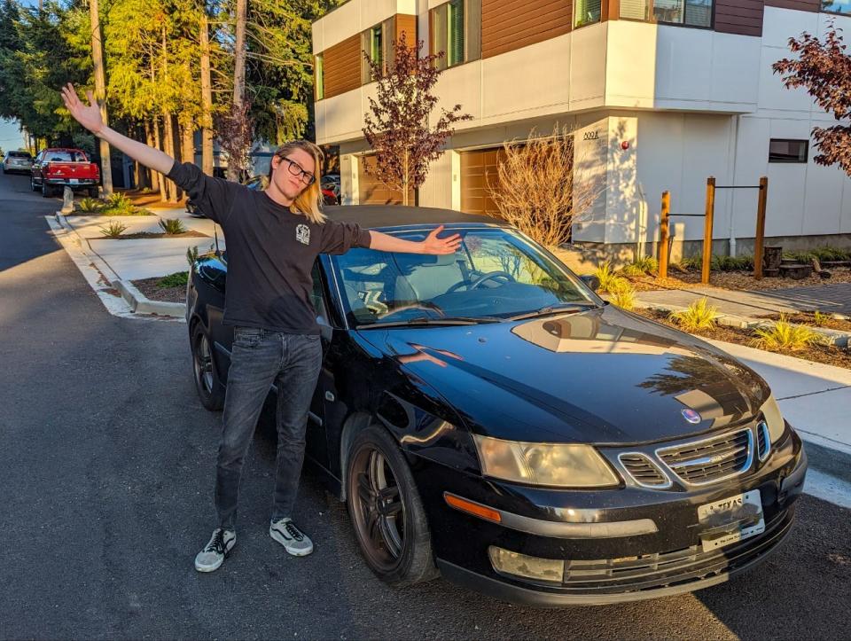 Joerger next to a car when he first arrived in Seattle.