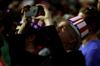 A supporter takes a photo of Republican presidential nominee Donald Trump during a campaign rally in Everett, Washington, U.S., August 30, 2016. REUTERS/Carlo Allegri