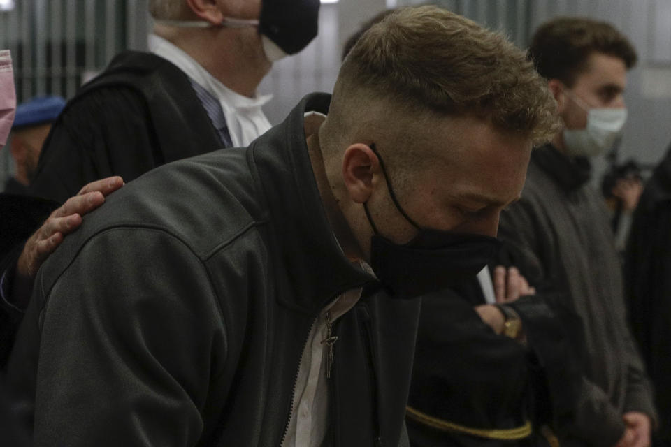 Finnegan Lee Elder and his co-defendant Gabriel Natale-Hjorth, right, listen as the verdict is read, in the trial for the slaying of an Italian plainclothes police officer on a street near the hotel where they were staying while on vacation in Rome in summer 2019, in Rome, Wednesday, May 5, 2021. A jury in Rome on Wednesday convicted two American friends in the 2019 slaying of a police officer in a drug sting gone awry, sentencing them to life in prison. The jury deliberated more than 12 hours before delivering the verdicts against Finnegan Lee Elder, 21, and Gabriel Natale Hjorth, 20, handing them Italy's stiffest sentence. (AP Photo/Gregorio Borgia)