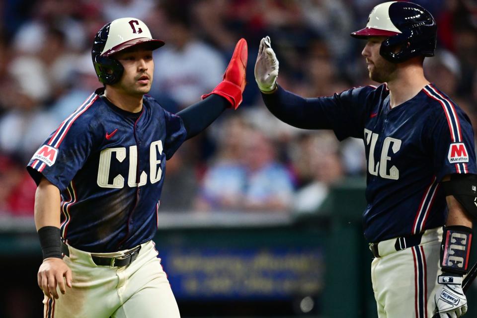 Cleveland Guardians' Steven Kwan (38) celebrates with catcher David Fry (6) after scoring during the seventh inning against the Washington Nationals on Friday in Cleveland.