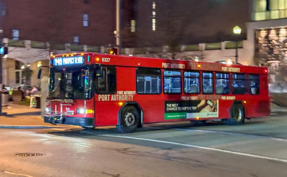 A red Port Authority bus in downtown Pittsburgh.
