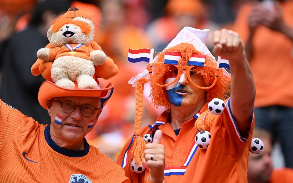 Fans of the Netherlands react as they enjoy the pre match atmosphere on the inside of the stadium prior to the UEFA EURO 2024 round of 16 match between Romania and Netherlands at Munich Football Arena on July 02, 2024 in Munich, Germany