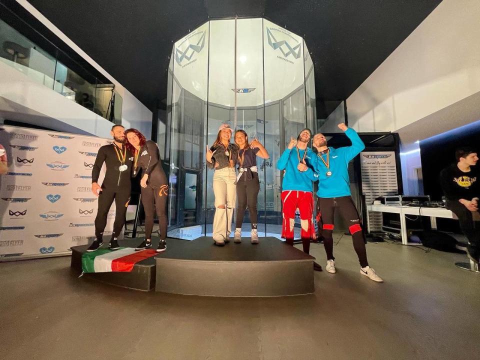 Singapore indoor skydivers Kyra and Vera Poh (centre) clinch gold in the 2-way dynamic speed category at the Open Belgium Championships in Charleroi. (PHOTO: iFly Singapore)