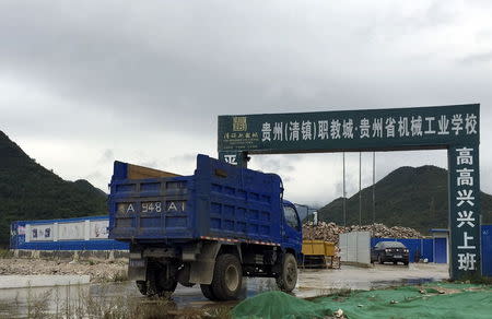 A truck is seen parking in front of a construction site of Guizhou Machinery Industry School, at Qingzhen Vocational Education City, in Guiyang, Guizhou province, China, September 24, 2015. REUTERS/Alexandra Harney