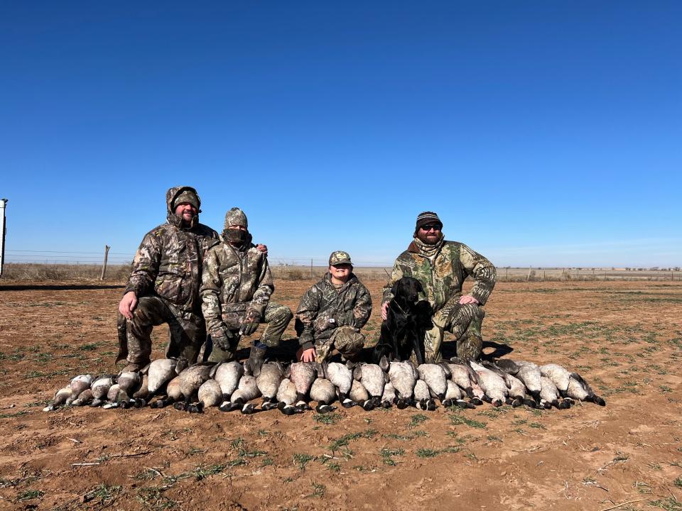 Ian Nance on the right with the retriever and the morning's bag of cackler geese, lesser Canada geese and wigeon.