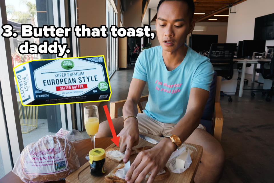 author slathering butter on toast