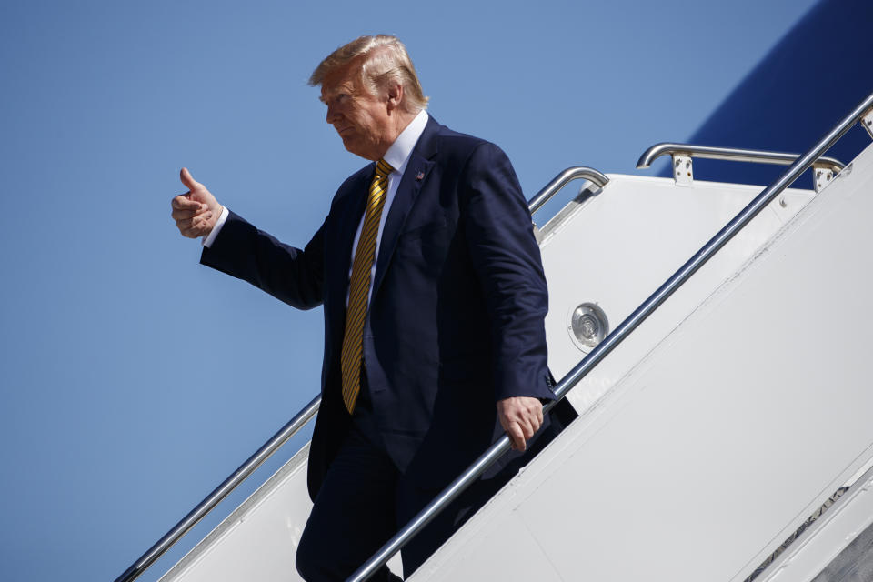 President Donald Trump arrives at Moffett Federal Airfield to attend a fundraiser, Tuesday, Sept. 17, 2019, in Mountain View, Calif. (AP Photo/Evan Vucci)