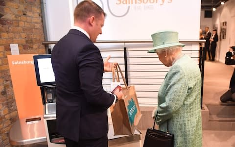 The Queen had her suspicions about the self-service check out - Credit: Reuters