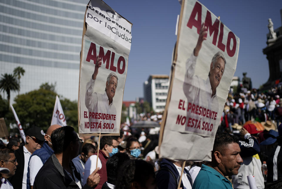 Supporters of Mexican President Andres Manuel Lopez Obrador arrive at the Angel of Independence monument prior a march to show their support of his administration, in Mexico City, Sunday, Nov. 27, 2022. (AP Photo/Eduardo Verdugo)