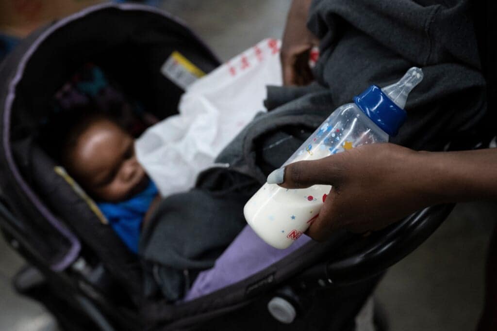 Rose Turner through a store with her son Robert Chase while looking for baby formula and money to buy it as the US struggles with a shortage of baby formula May 19, 2022, in Washington, DC. (Photo by Brendan Smialowski / AFP) (Photo by BRENDAN SMIALOWSKI/AFP via Getty Images)