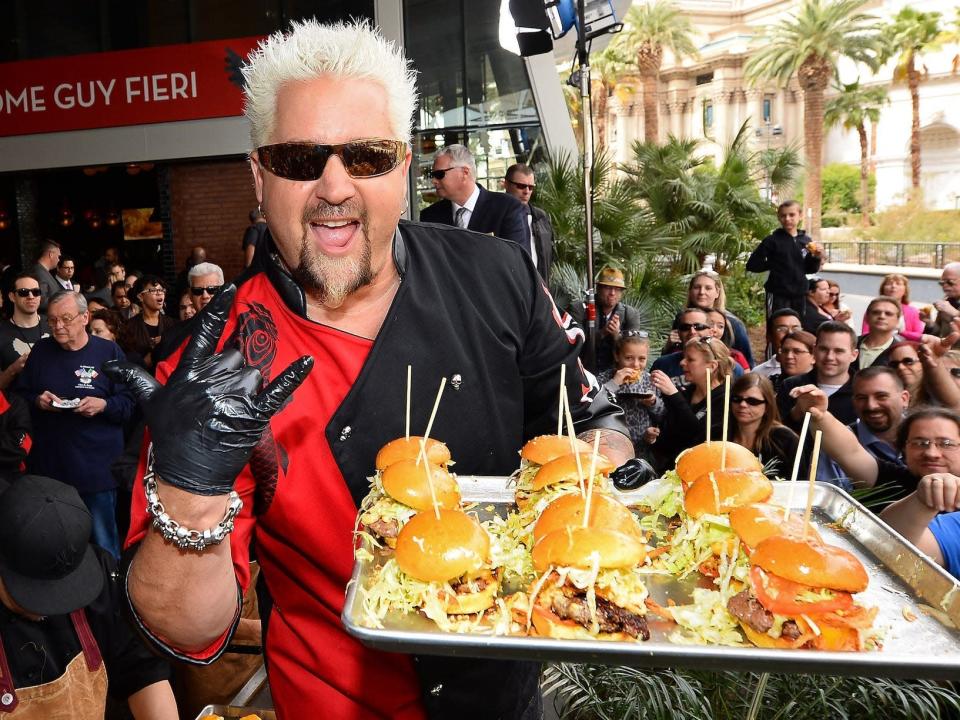 Guy Fieri with burgers