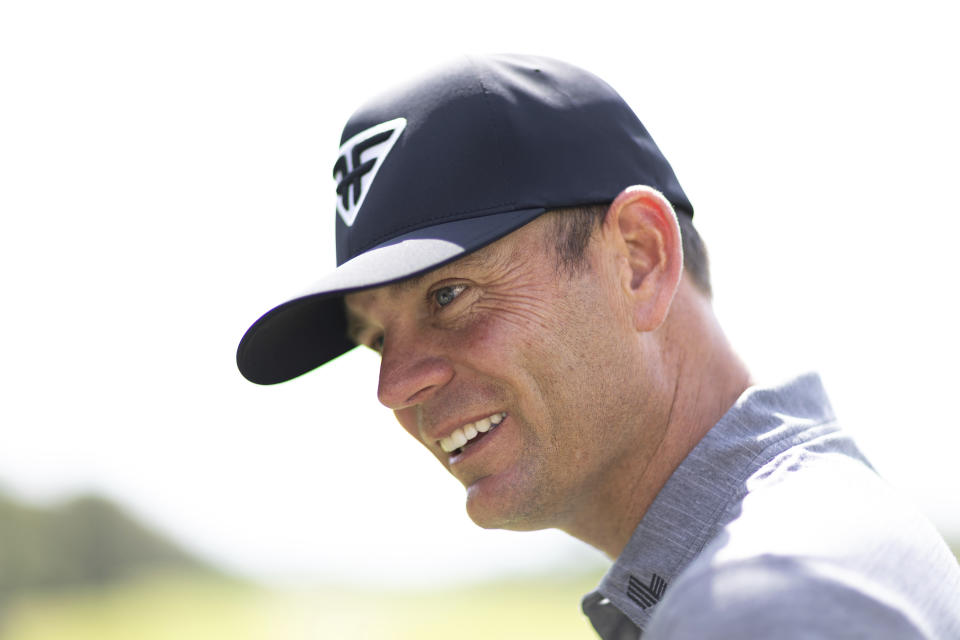 Brendan Steele of HyFlyers GC speaks to a contestant on the driving range during the first round of the LIV Golf Mayakoba at El Camaleón Golf Course on Friday, Feb. 24, 2023 in Playa del Carmen, Mexico. (Jon Ferrey/LIV Golf via AP)