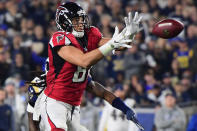 <p>Tight end Austin Hooper #81 of the Atlanta Falcons makes a catch in front of inside linebacker Mark Barron #26 of the Los Angeles Rams during the second quarter of the NFC Wild Card Playoff game at Los Angeles Coliseum on January 6, 2018 in Los Angeles, California. (Photo by Harry How/Getty Images) </p>