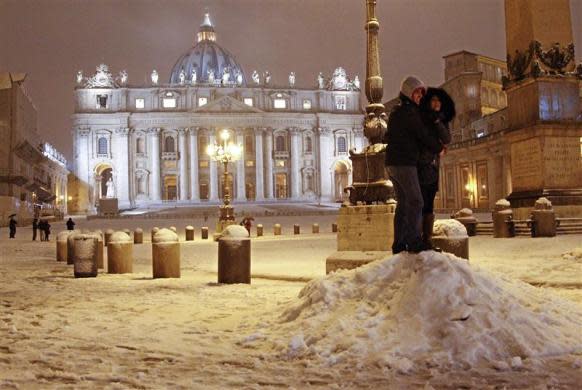 A couple hugs during a heavy snowfall at Saint Peter's Square at the Vatican February 10, 2012.