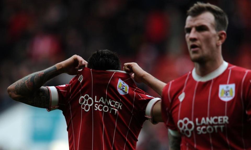 A dejected Eros Pisano and Aden Flint, of Bristol City.