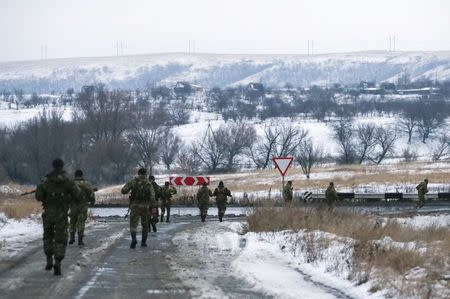 Pro-Russian separatists from the Chechen "Death" battalion take part in a training exercise in the territory controlled by the self-proclaimed Donetsk People's Republic, eastern Ukraine, December 8, 2014. REUTERS/Maxim Shemetov