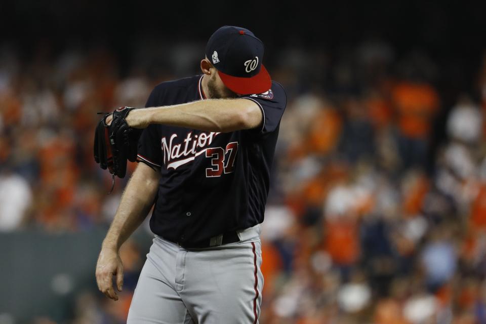 Washington Nationals starting pitcher Stephen Strasburg reacts after giving up a walk during the fourth inning of Game 6 of the baseball World Series against the Houston Astros Tuesday, Oct. 29, 2019, in Houston. (AP Photo/Matt Slocum)