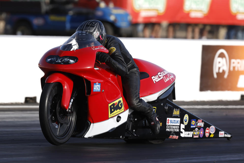 In this photo provided by the NHRA, Karen Stoffer drives in Pro Stock Motorcycle qualifying Friday, April 22, 2022, during the NHRA SpringNationals drag races at Houston Raceway Park in Baytown, Texas. (Randy Anderson/NHRA via AP)