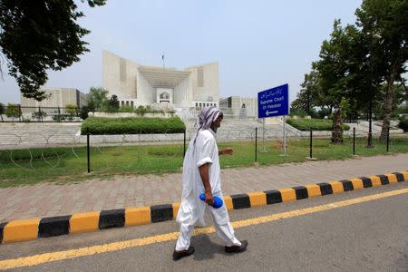 A man walks past the Supreme Court building in Islamabad, Pakistan, June 27, 2016. Picture taken June 27, 2016. REUTERS/Faisal Mahmood