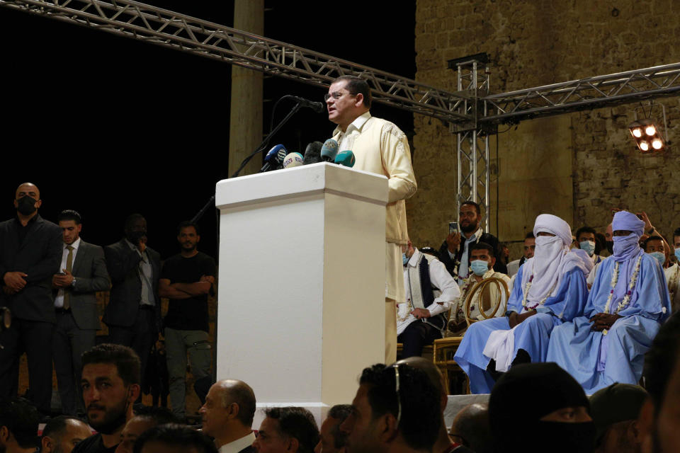 Interim Prime Minister of Libya Abdul Hamid Dbeibah addresses supporters at a protest calling for the country’s parliament to step down, on Friday, Sept. 24, 2021, in Tripoli, after it passed a vote of no-confidence in Dbeibah’s transitional government. The motion, passed on Tuesday, represents a challenge to planned December elections and impedes efforts to unite the oil-rich North African nation after a decade of turmoil. (AP Photo/Yousef Murad)