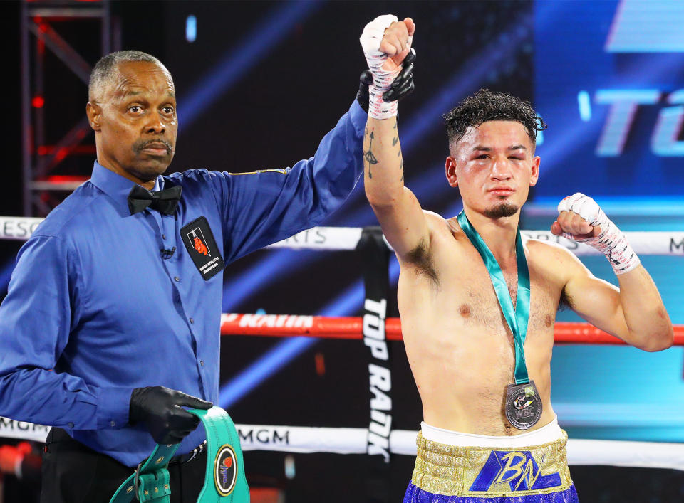 Adam Lopez celebrates after earning a 10-round majority decision over Louie Coria on June 11 at the MGM Grand Conference Center in Las Vegas. (Mikey Williams/Top Rank)