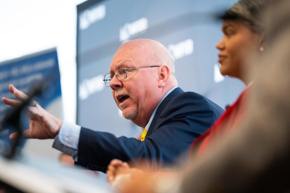 Donald Rainwater, middle, addresses the audience during the National Federation of Independent Businesses gubernatorial candidate forum and luncheon on Tuesday, March 19, 2024, at the Wellington Fishers Banquet & Conference Center in Fishers, Indiana.