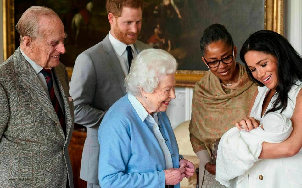 Prince Harry and Meghan were joined by her mother, Doria Ragland, to show Archie to the Queen and Prince Philip at Windsor Castle when he was born - AP
