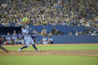 Toronto Blue Jays centre fielder George Springer (4) triples on a line drive in the seventh inning of American League baseball action against Boston Red Sox in Toronto on Friday, Aug. 6, 2021. (Christopher Katsarov/The Canadian Press via AP)