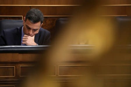 Spanish Prime Minister Pedro Sanchez reviews a document during a session at Parliament in Madrid, Spain, December 12, 2018. REUTERS/Susana Vera