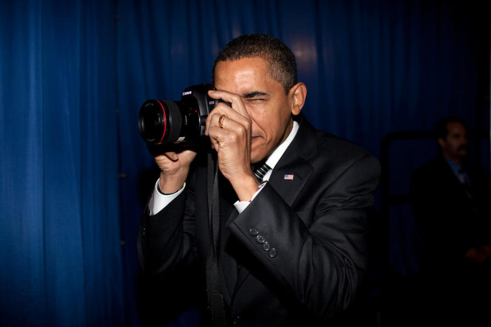 Obama takes aim with a photographer's camera backstage before delivering&nbsp;remarks about providing mortgage payment relief for responsible homeowners at Dobson High School in Mesa, Arizona, on Feb. 18, 2009.