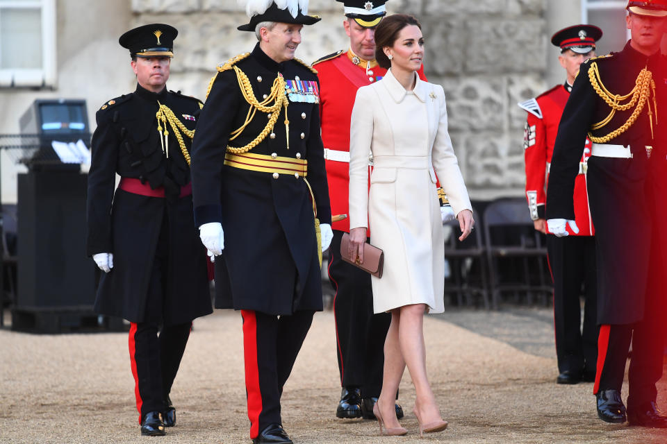 Kate made her debut at the Beating Retreat military ceremony to take the salute, wearing a repeat cream Catherine Walker coat with her Gianvito Rossi praline pumps, her Mulberry blush pink 'Amberley' clutch and her Cassandra Goad pearl stud earrings. [Photo: PA]