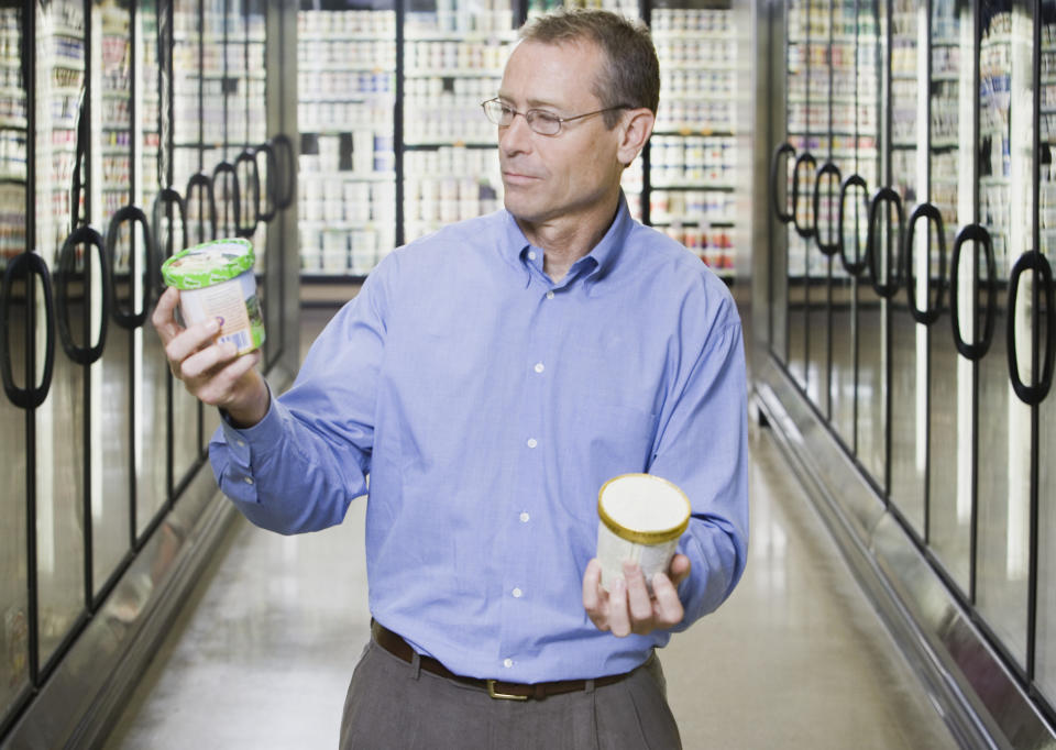 A man holding pints of ice cream