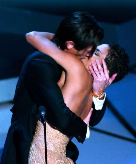 Actor Adrien Brody suprises presenter Halle Berry with a kiss after he won the Oscar for best actor for his work in The Pianist at the 75th annual Academy Awards Sunday, March 23, 2003, in Los Angeles. (AP Photo/Kevork Djansezian)