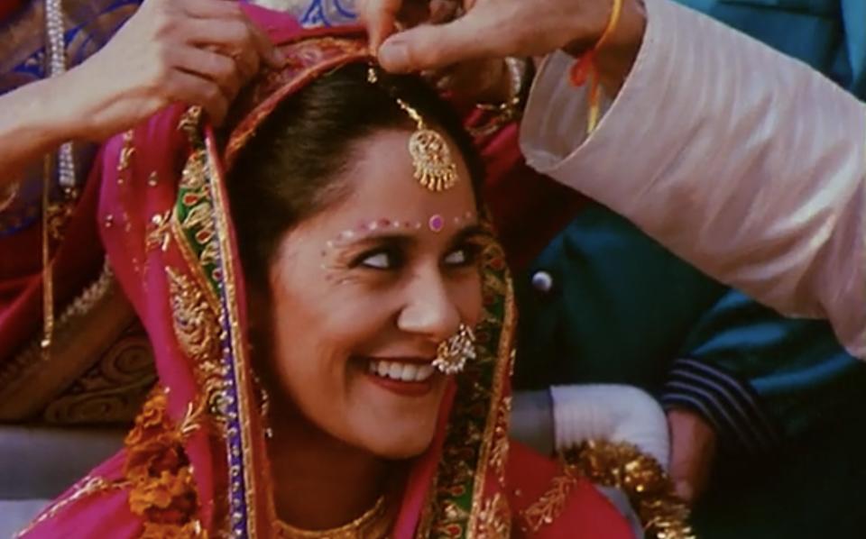 Sakina Jaffreey wears a Indian, traditional Indian dress, and smiles.