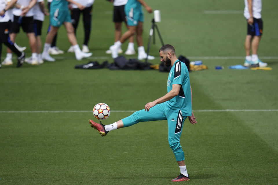 Real Madrid's Karim Benzema controls the ball during a Media Opening day training session in Madrid, Spain, Tuesday, May 24, 2022. Real Madrid will play Liverpool in Saturday's Champions League soccer final in Paris. (AP Photo/Manu Fernandez)