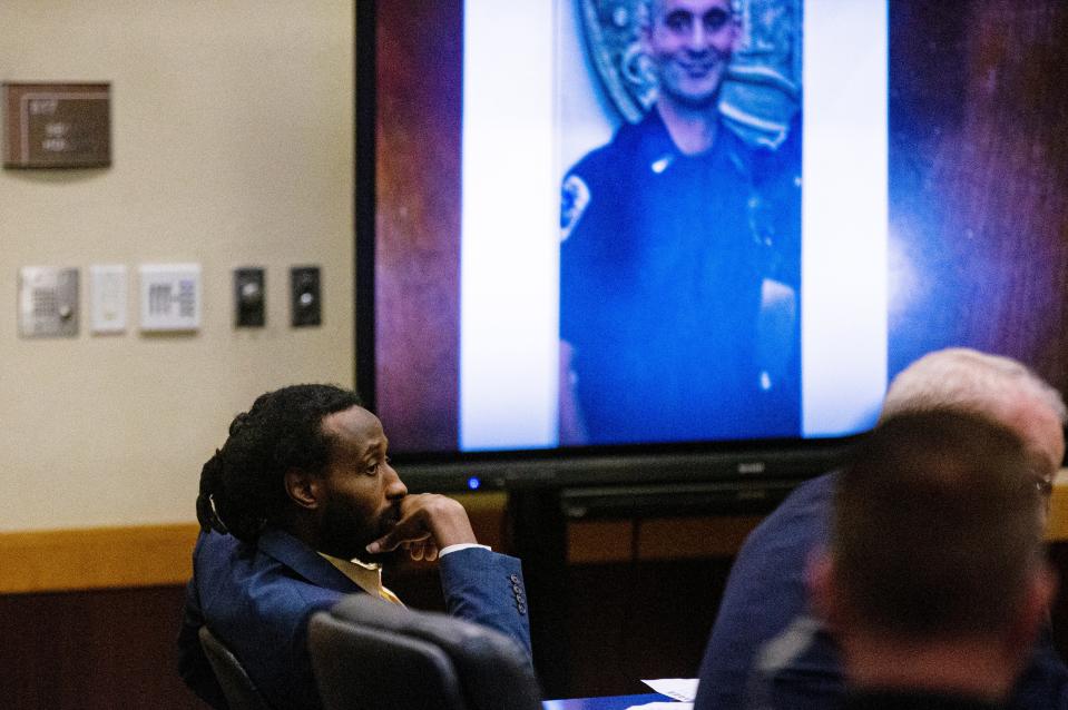 A photo of fallen Fort Myers Police Officer Adam Jobbers-Miller is shown as evidence during the trial of Wisner Desmaret on Monday, April 10. Desmaret is accused in the murder Jobbers-Miller in 2018.