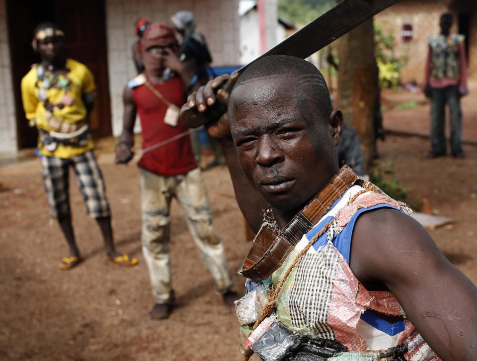 A member of anti-balaka, a Christian militia, poses with his machete in village of Zawa