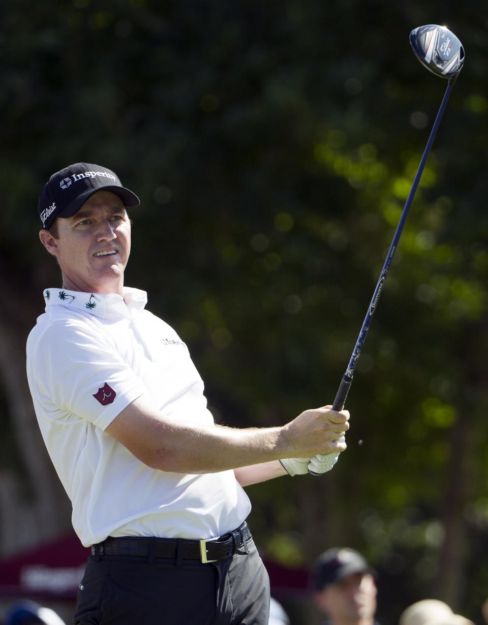 Jimmy Walker watches his drive off the first tee during the fourth round of the Sony Open golf tournament at Waialae Country Club, Sunday, Jan. 12, 2014, in Honolulu. (AP Photo/Eugene Tanner)