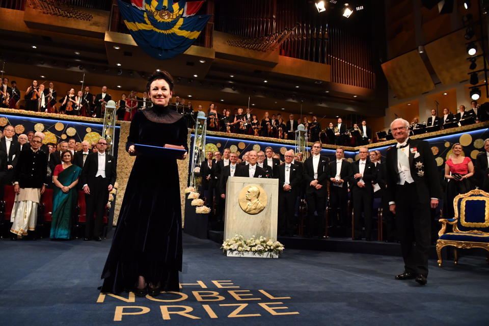 Polish author Olga Tokarczuk, left, receives the Nobel prize from King Carl Gustaf of Sweden, during the Nobel Prize award ceremony at the Stockholm Concert Hall, in Stockholm, Tuesday, Dec. 10, 2019. (Jonas Ekstromer/TT News Agency via AP)