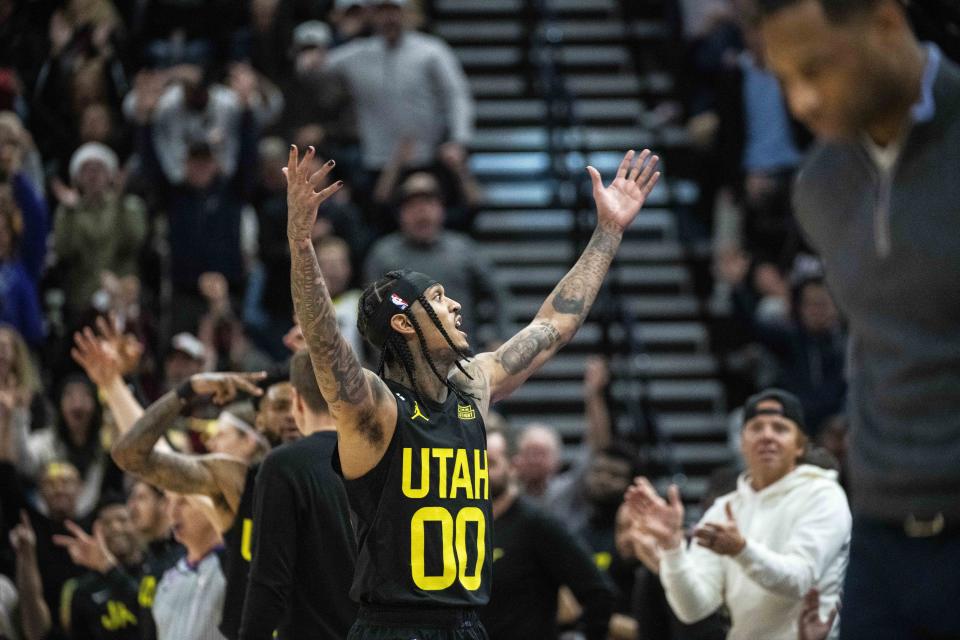 Utah Jazz guard Jordan Clarkson (00) celebrates his buzzer-beater shot to end the third quarter against the New Orleans Pelicans during an NBA basketball game Tuesday, Dec. 13, 2022, in Salt Lake City. (AP Photo/Isaac Hale)