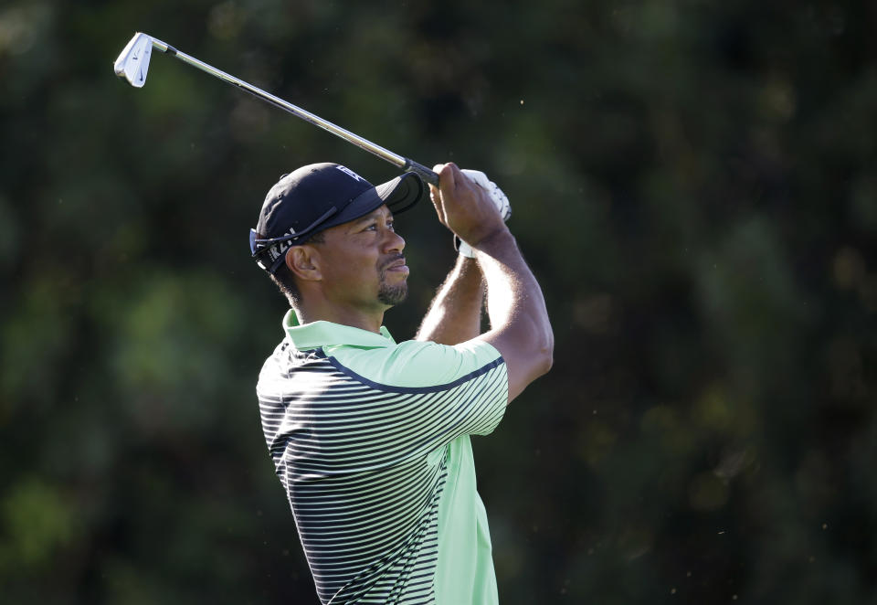 Tiger Woods watches his shot after teeing off on the 15th hole during the second round of the Honda Classic golf tournament, Friday, Feb. 28, 2014, in Palm Beach Gardens, Fla. (AP Photo/Wilfredo Lee)