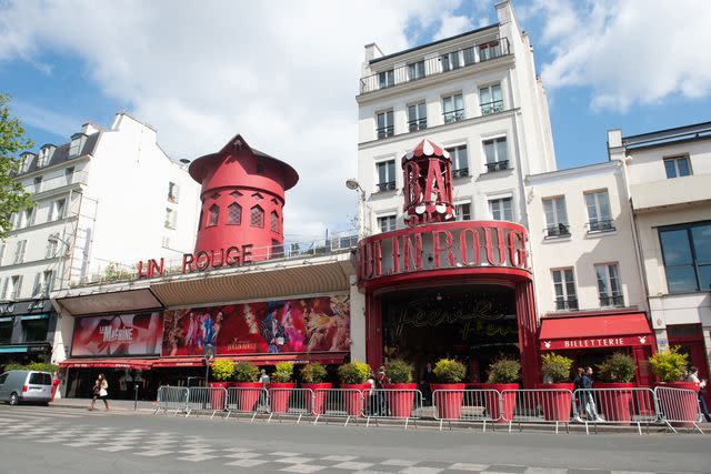 <p>Kay-Paris Fernandes/Getty</p> The Moulin Rouge, seen without its sails and missing letters.