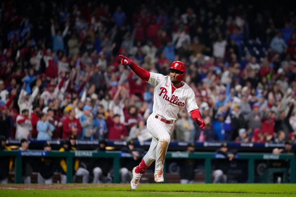 Philadelphia Phillies' Johan Rojas celebrates after hitting a game-winning run-scoring single in the 10th inning of a baseball game against the Pittsburgh Pirates to clinch a wild-card playoff spot, Tuesday, Sept. 26, 2023, in Philadelphia.