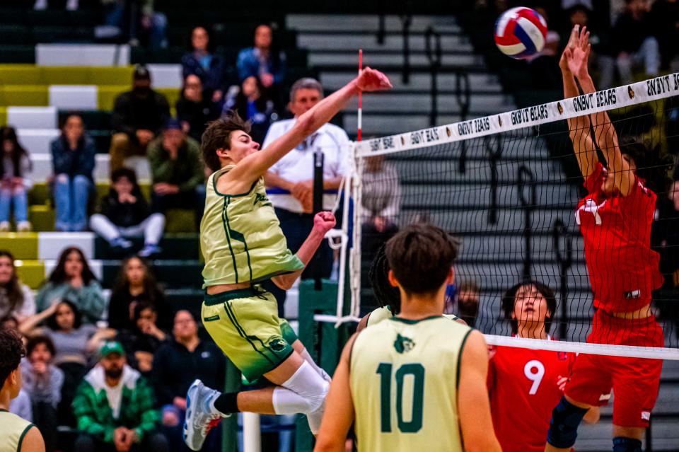 GNB Voc-Tech's Colin Stuessi goes for the cross court spike.