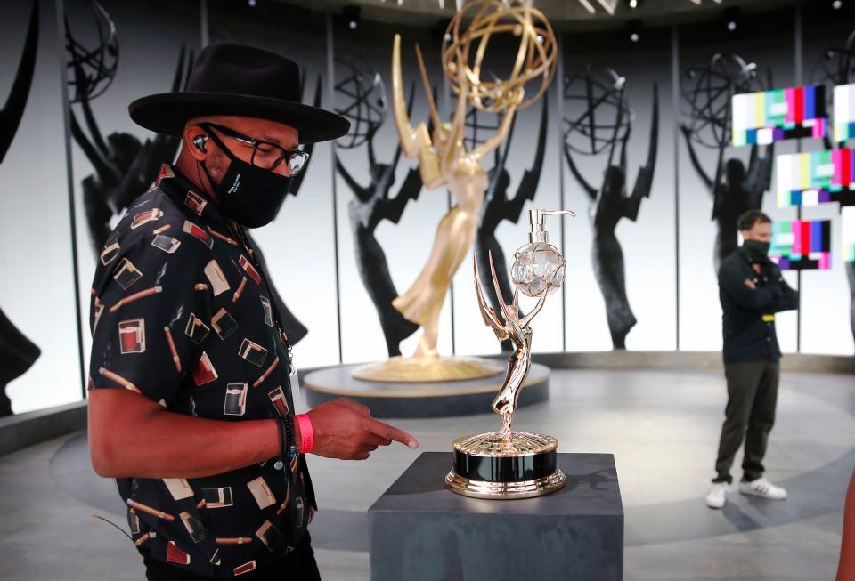 Checking out the Emmy hand sanitizer dispenser.  (Al Seib via Getty Images)