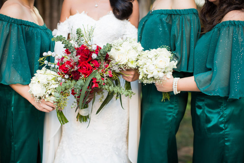 closeup of hands holding bouquets